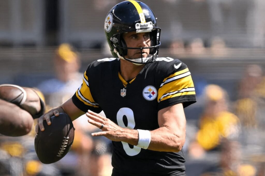 Aaron Rodgers celebrates after throwing a touchdown pass for the Pittsburgh Steelers against the Miami Dolphins at Acrisure Stadium.