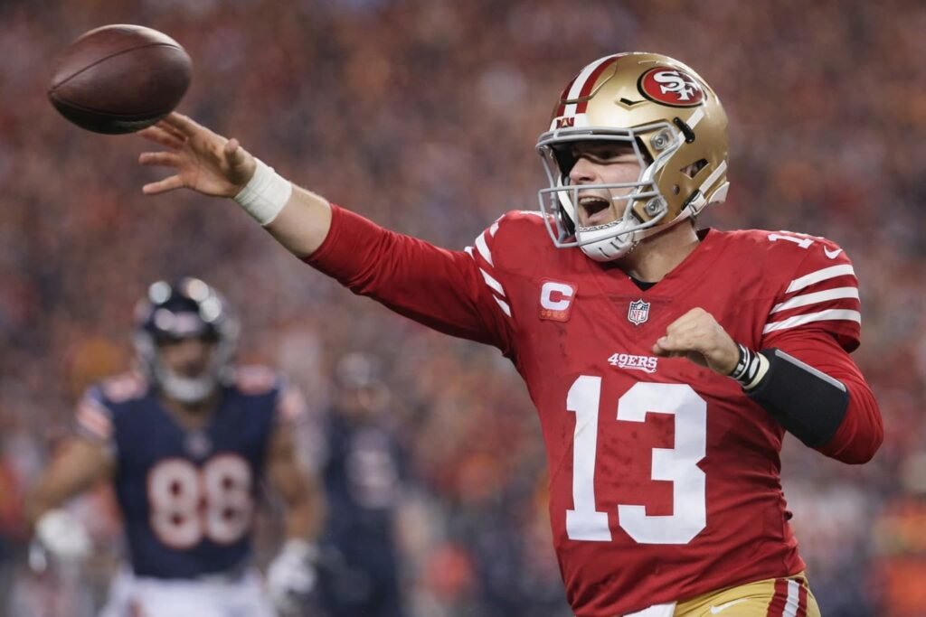 Brock Purdy throwing a touchdown pass during 49ers vs Bears Sunday Night Football