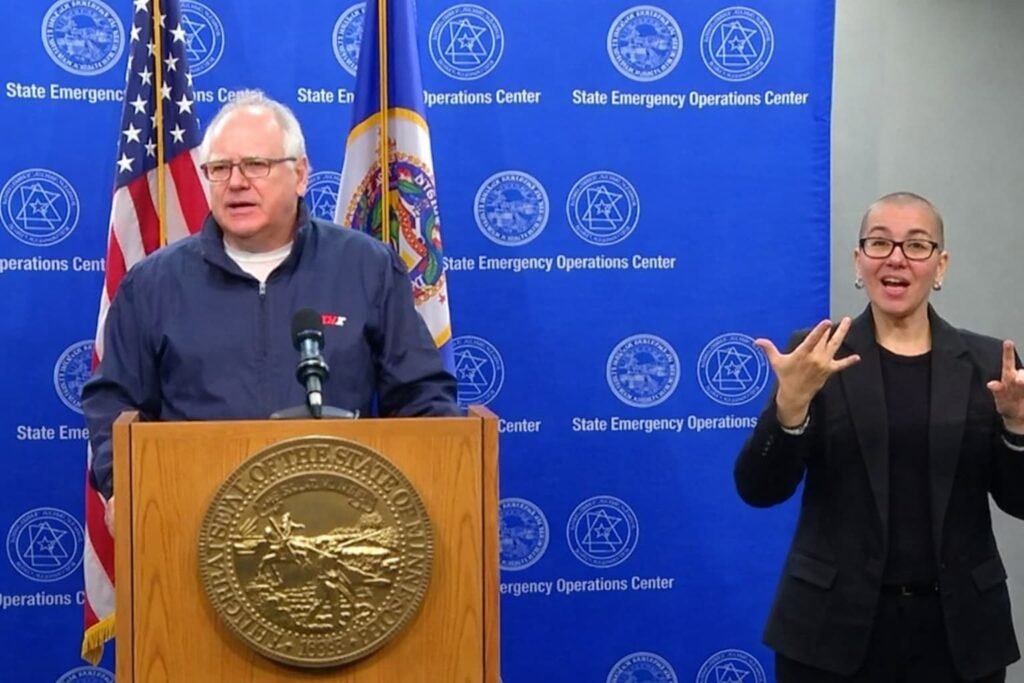 Governor Tim Walz speaking at a Minnesota press conference