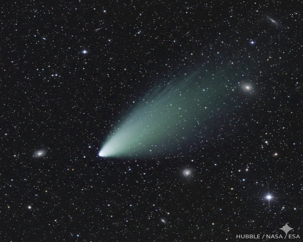 Hubble image showing teardrop-shaped coma of interstellar comet 3I/ATLAS against a dark starfield