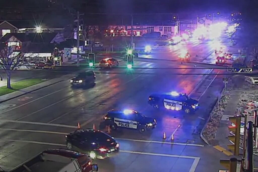 Emergency vehicles and police lights outside a church building following a deadly shooting in Salt Lake City.