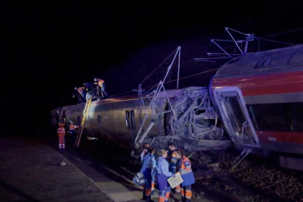 Rescue workers inspect overturned high-speed train carriages after a deadly collision near Adamuz, Spain.