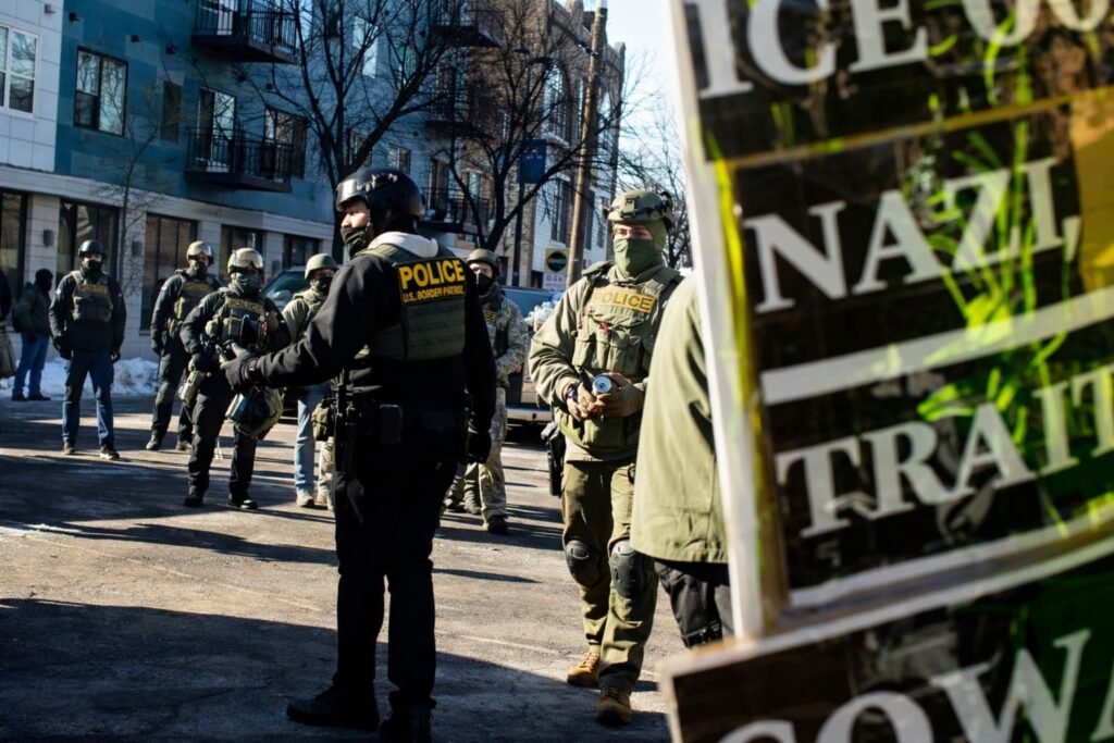 Federal agents and protesters face off during immigration enforcement operations in Minneapolis.