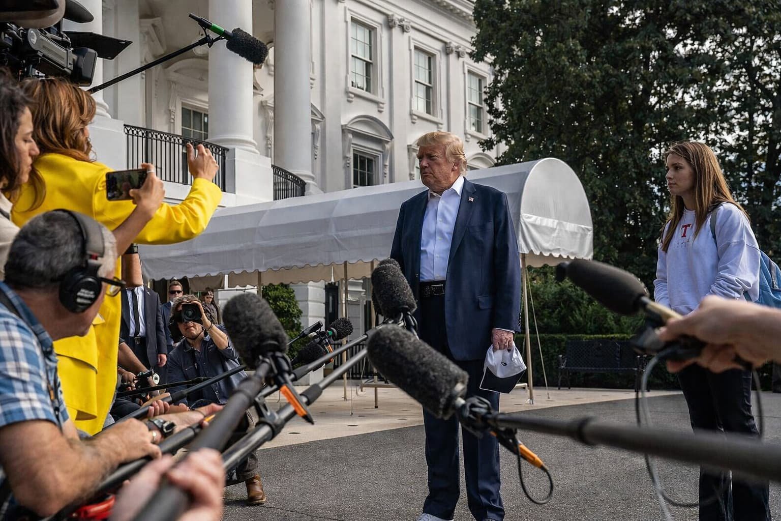 President Donald Trump speaking to reporters on the South Lawn of the White House