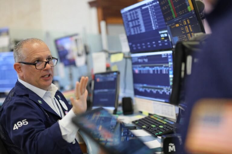 Wall Street trader watching screens showing the Dow Jones Industrial Average entering correction territory after five consecutive weeks of losses driven by Iran war oil prices in March 2026