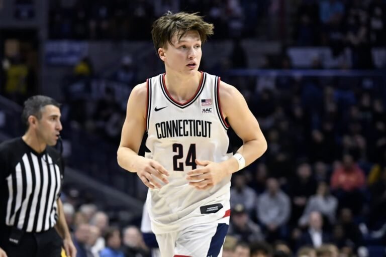 UConn freshman Braylon Mullins celebrating after hitting a 35-foot three-pointer with 0.4 seconds remaining to beat No. 1 seed Duke 73-72 and complete a 19-point comeback in the Elite Eight of the 2026 NCAA Tournament at Capital One Arena in Washington D.C.