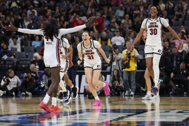 South Carolina Gamecocks celebrating their Elite Eight victory as the undefeated 35-0 Gamecocks advance to the Final Four seeking to become the first team to finish a season at 37-0 in NCAA women's basketball history