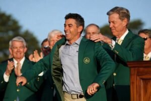 Rory McIlroy receiving green jacket from Augusta National chairman after 2026 Masters victory