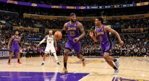 LeBron James and Bronny James on court together for Los Angeles Lakers in 2026 NBA Playoffs Game 1 versus Houston Rockets