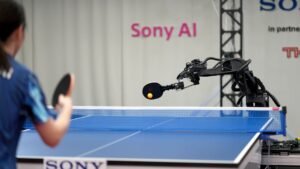 Sony AI table tennis robot Ace facing elite human player across full-sized regulation table during official match testing published in Nature
