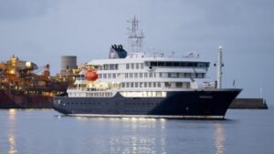 Dutch-flagged expedition cruise ship MV Hondius anchored outside Tenerife in Canary Islands as hantavirus outbreak sends 17 passengers ashore for controlled disembarkation May 10 2026