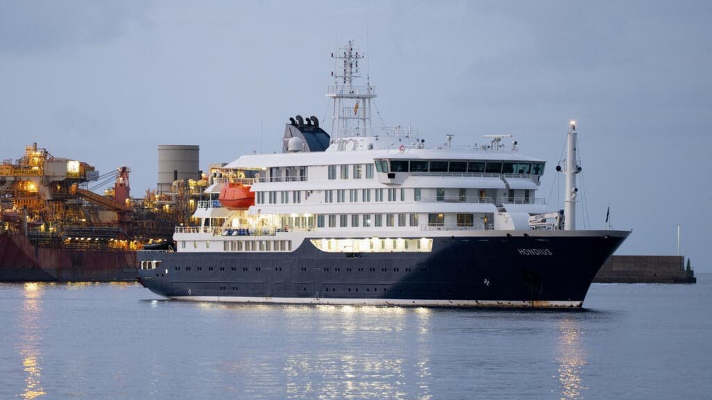Dutch-flagged expedition cruise ship MV Hondius anchored outside Tenerife in Canary Islands as hantavirus outbreak sends 17 passengers ashore for controlled disembarkation May 10 2026
