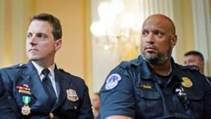 Officer Daniel Hodges and former officer Harry Dunn at press conference announcing federal lawsuit to block Trump's $1.776 billion Anti-Weaponization Fund May 2026