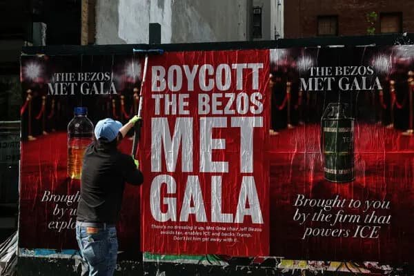 Boycott the Bezos Met Gala protest posters plastered on Manhattan bus stops near Metropolitan Museum of Art as celebrities skip 2026 gala over Jeff Bezos ten million dollar sponsorship