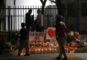 Flowers and tributes left outside the Islamic Center of San Diego following May 18 2026 shooting that killed security guard Amin Abdullah and two other community members