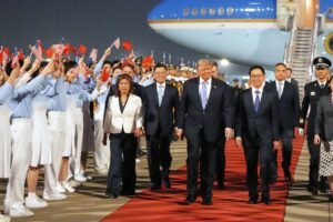 President Trump boarding Air Force One departing for Beijing as he prepares for May 14-15 summit with President Xi Jinping where China enters negotiations from position of confidence after rare earth leverage success 2026