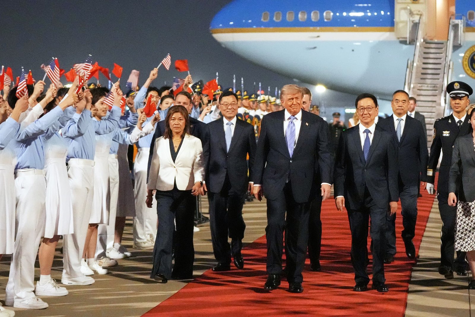 President Trump boarding Air Force One departing for Beijing as he prepares for May 14-15 summit with President Xi Jinping where China enters negotiations from position of confidence after rare earth leverage success 2026