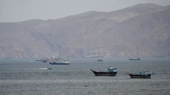 US Navy warship firing at Iranian fast attack boats in Strait of Hormuz during Project Freedom commercial ship escort operation as first direct military exchange since ceasefire occurs May 4 2026