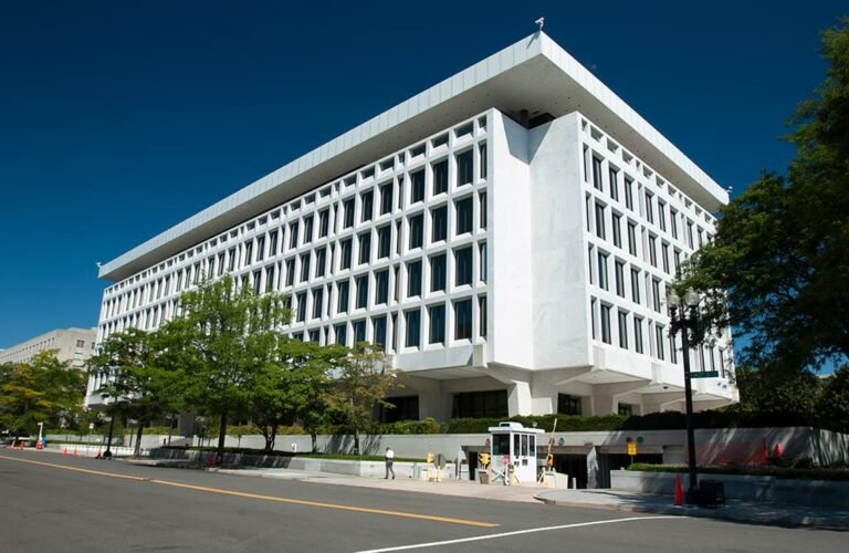 Federal Reserve building in Washington as Kevin Warsh prepares to inherit strong ADP jobs data and Iran peace deal optimism that could either delay or accelerate rate cuts in 2026