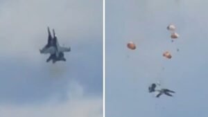 Four parachutes visible in Idaho sky as all crew members eject safely from two colliding Navy EA-18G Growler jets during Mountain Home air show May 2026