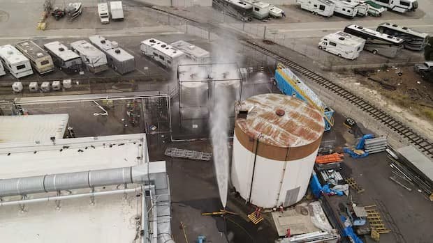 Water being sprayed on overheating 34,000-gallon methyl methacrylate tank at GKN Aerospace facility in Garden Grove California as OCFA firefighters work to prevent BLEVE explosion May 2026