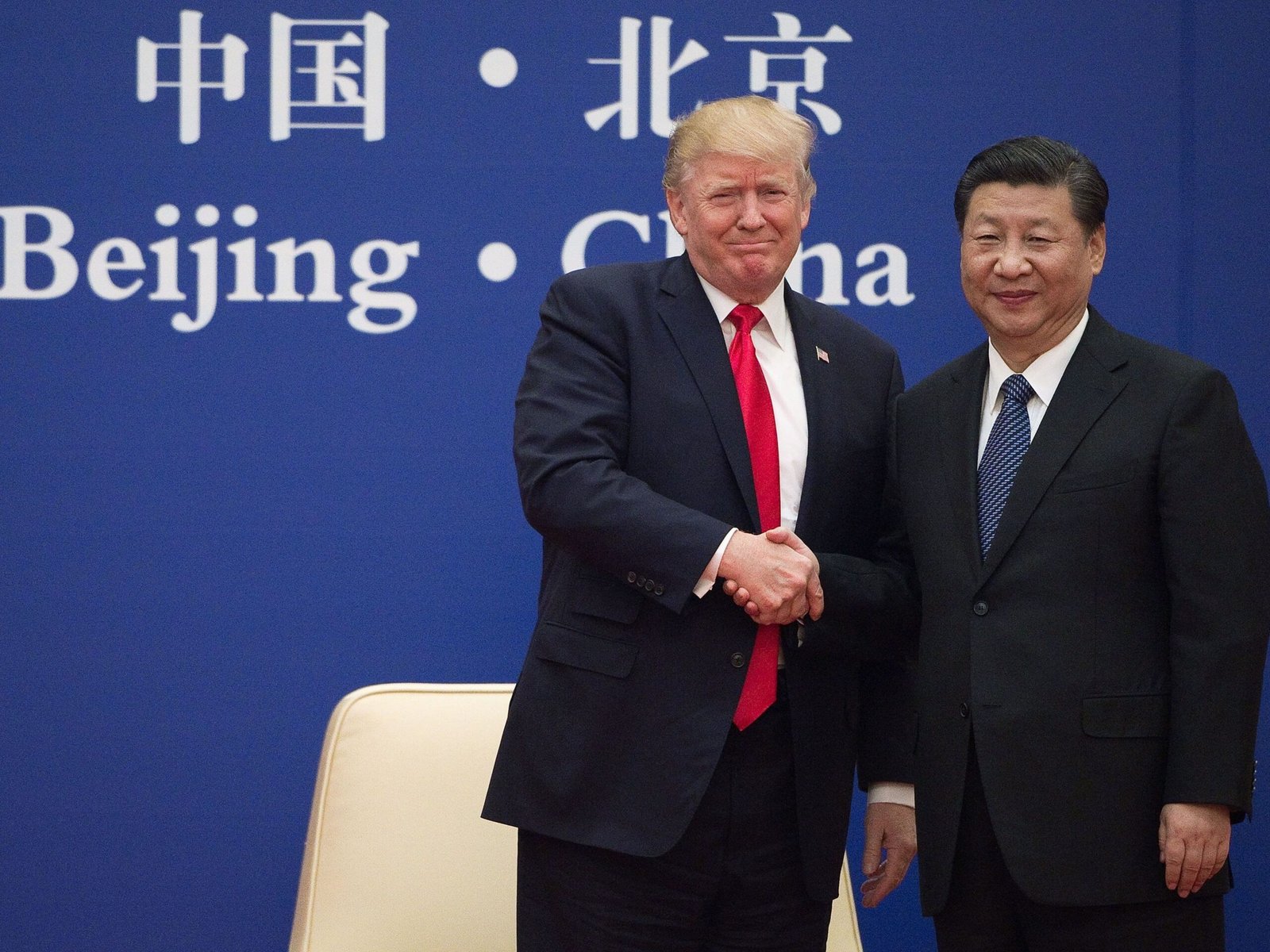 Trump and Xi Jinping handshake at previous summit as May 14 Beijing meeting becomes most important diplomatic event for oil prices and Iran war resolution in 2026