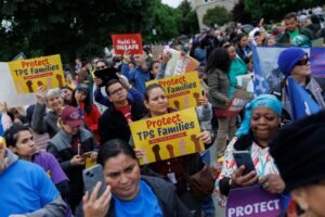 Haitian immigrants outside courthouse representing 350,000 Haitians who lose Temporary Protected Status after Supreme Court rules 6-3 in favor of Trump administration June 2026
