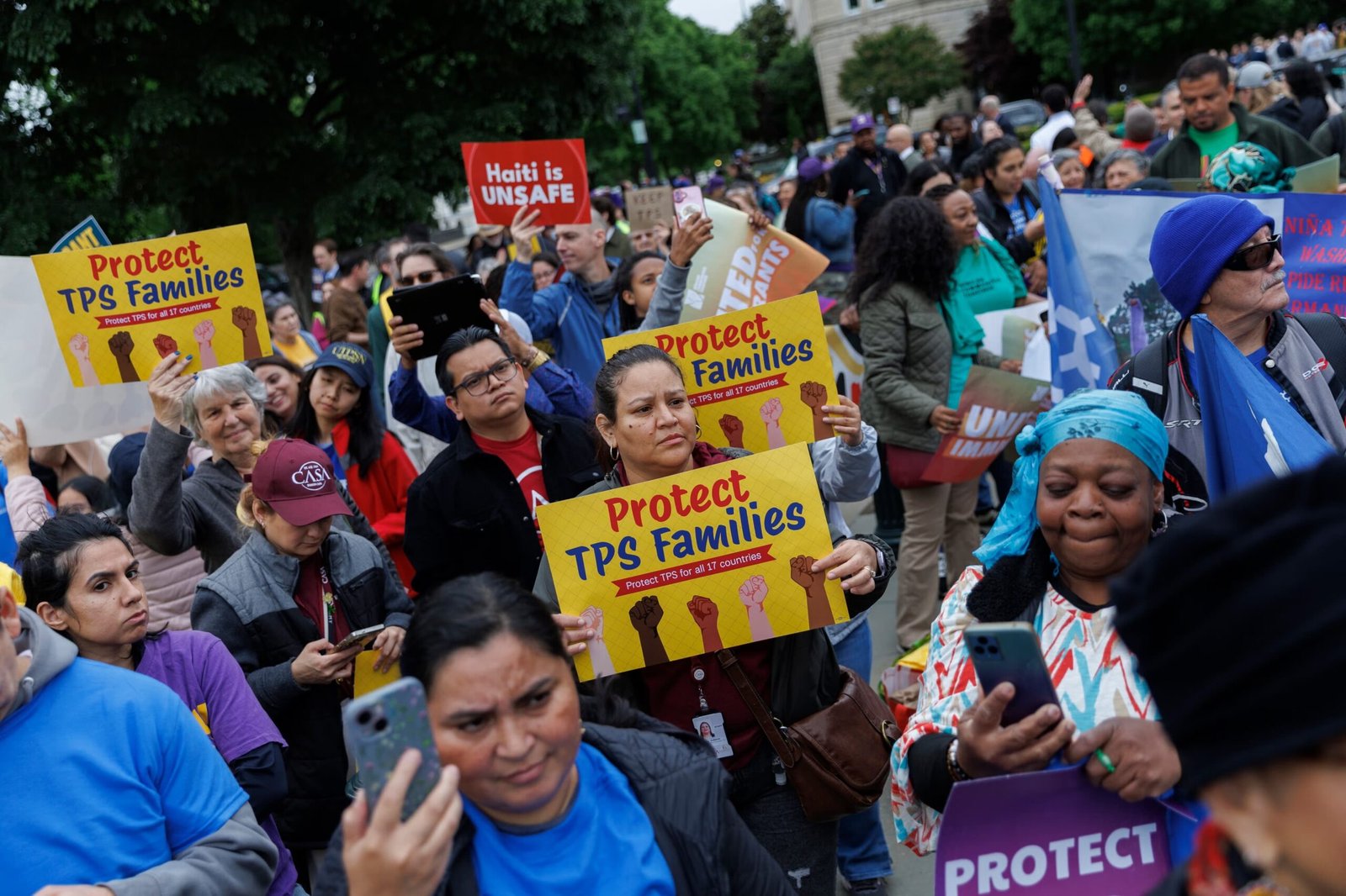 Haitian immigrants outside courthouse representing 350,000 Haitians who lose Temporary Protected Status after Supreme Court rules 6-3 in favor of Trump administration June 2026