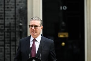 UK Prime Minister Keir Starmer delivering resignation statement outside 10 Downing Street in London on June 22 2026 flanked by wife Victoria Starmer