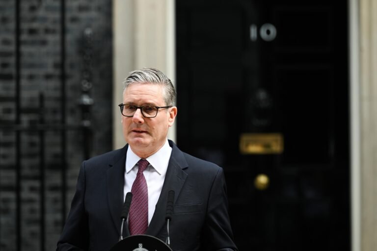 UK Prime Minister Keir Starmer delivering resignation statement outside 10 Downing Street in London on June 22 2026 flanked by wife Victoria Starmer