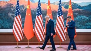 US and China flags displayed at diplomatic summit in Beijing representing escalating export control sanctions between the two countries in June 2026